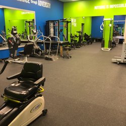 Strengthening, cardio, and weight bearing equipment on the interior of the gym.
