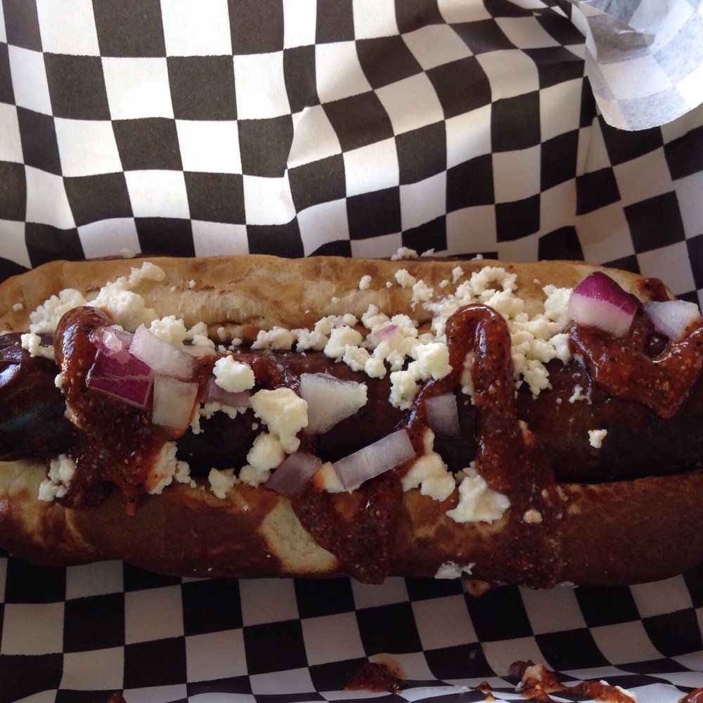 Moon Tower - Venison hotdog with red wine and blue berries with Chef's dressings. - Dive Bars Near Me - Houston, Texas