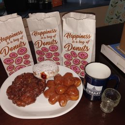 Apple fritter, strawberry jam filled powdered donut and a donut 'pine cone' Apple fritter, strawberry jam filled powdered donut and a donut 'pine cone'