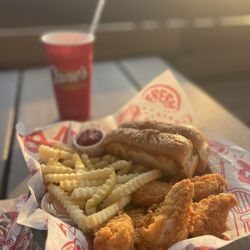 Raising Cane's Chicken Fingers - Chicken and fries