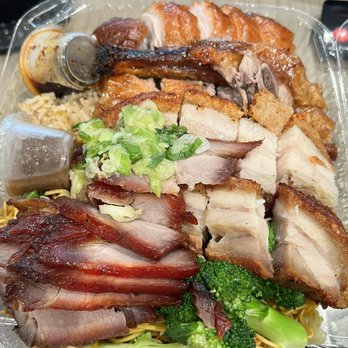Do Eat Restaurant - From top - roast duck, crispy pork, BBQ pork char siu over rice and noodles. Some chili sauce and broccoli too. - Chinese Near Me - San Francisco, California