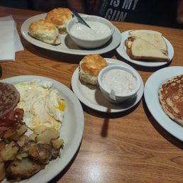 Fried eggs,  potatoes,  sausage,  bacon,  pancake, biscuits & gravy & breakfast sandwich