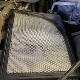Bent and mismanaged engine air filter. Bent and mismanaged engine air filter.