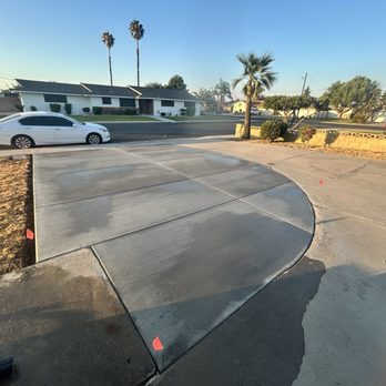 Elite Landscaping - After picture. Concrete install to expand driveway. - Landscaping Near Me