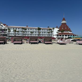 Hotel del Coronado, Curio Collection by Hilton - My 78 year old mother with dementia sitting in a wheel chair in the sand because the lounge boy asked her to leave a lounge bed - Coronado, CA