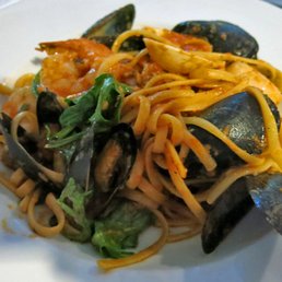 Linguine ai frutti di mare (linguine with jumbo shrimps, scallops, mussels, clams, garlic, tomato, herbs, white wine, arugula)