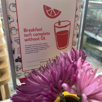 De Dutch - a yellow vase with a purple flower in it - Breakfast & Brunch Near Me - Surrey, British Columbia