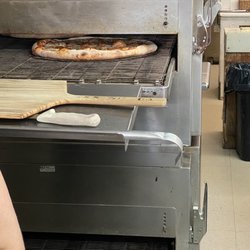 Charlie's Pizza - Fresh hot pizza going in