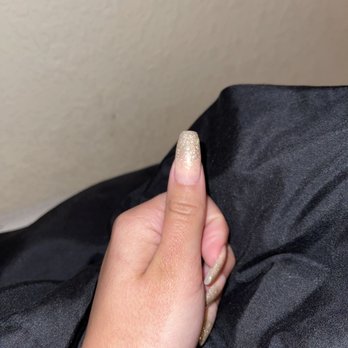 The White Orchid - two nail shades were blended poorly and the right corner was smudged with a paper towel while drying under the blue light - Nail Salons Near Me - San Antonio, Texas