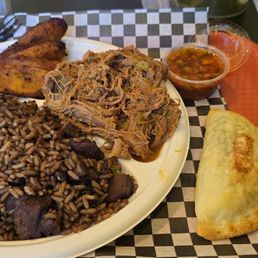 Delicious Shredded beef, sweet plantains, spinach/cheese Empanada & Cuban rice Delicious Shredded beef, sweet plantains, spinach/cheese Empanada & Cuban rice