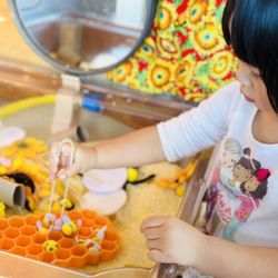 Annie's Alphabet Preschool and Home Childcare - Working on finger strength and coordination in the sensory bin-