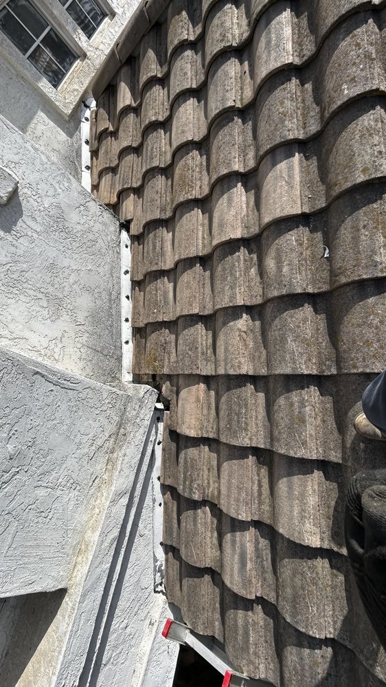 Slide of J&E Roofing Services