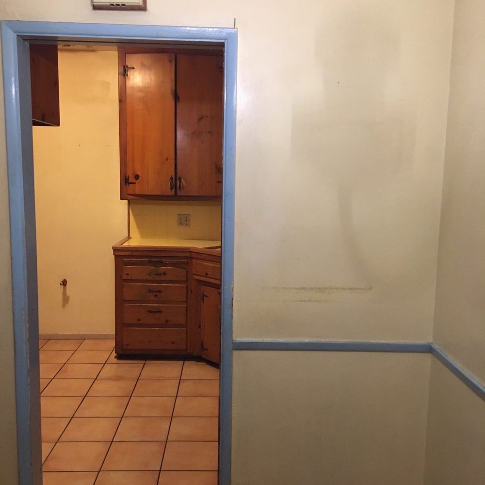 Junk Demo Pros - Before photo of kitchen. As if I would leave this section of wall and pocket door on an open concept kitchen. - Junk Removal & Hauling Near Me Junk Demo Pros - Before photo of kitchen. As if I would leave this section of wall and pocket door on an open concept kitchen. - Junk Removal & Hauling Near Me