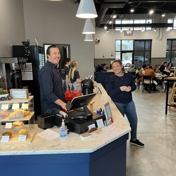 Poppyseed Kitchen - a man and a woman standing in front of a counter - Breakfast & Brunch Near Me - Fort Mill, South Carolina Poppyseed Kitchen - a man and a woman standing in front of a counter - Breakfast & Brunch Near Me - Fort Mill, South Carolina