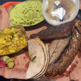 Tray for 1, with turkey, sausage, green spaghetti, stew, and pineapple upside down cobbler