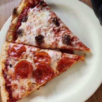 Nimarcos Pizza - Westside - Slice of pepperoni and a slice of sausage. - Pizza Near Me - Flagstaff, Arizona