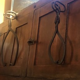 Ice tongs. One in front of each cabinet for ice.
