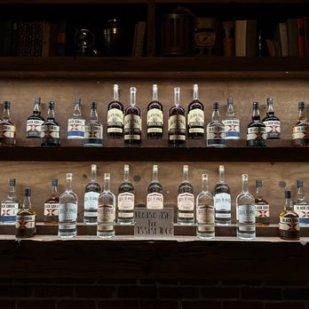 Steel Tie Spirits - a shelf of liquor bottles - Distilleries Near Me - West Palm Beach, Florida Steel Tie Spirits - a shelf of liquor bottles - Distilleries Near Me - West Palm Beach, Florida