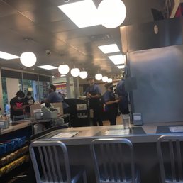 people in the kitchen at the counter people in the kitchen at the counter
