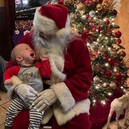 Great grandson with Santa Clause, not a fan!!