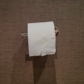 AC Hotel by Marriott Madison Downtown - The toilet paper holder, is not level.  Therefore, the toilet paper roll repeatedly fell on the floor and unraveled, which is gross. - Hotels Near Me - Madison, Wisconsin