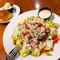 Harris Ranch Resort - Chopped wedge salad, extra dressing on the side, with a cheddar cheese roll.