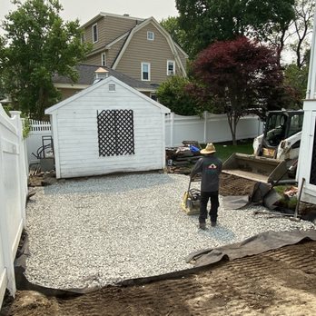 Edin & Sons Hardscape Construction - a man working on a patio - Landscaping Near Me