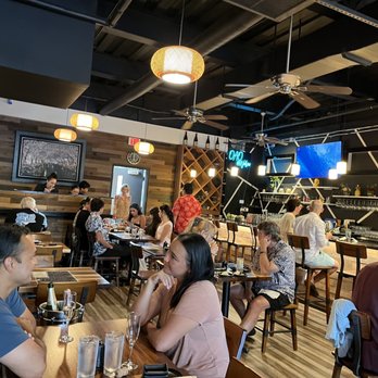 Oao - Sushi Bar & Grill at Wailea - a group of people sitting at tables in a restaurant - Sushi Bars Near Me - Kihei, Hawaii Oao - Sushi Bar & Grill at Wailea - a group of people sitting at tables in a restaurant - Sushi Bars Near Me - Kihei, Hawaii
