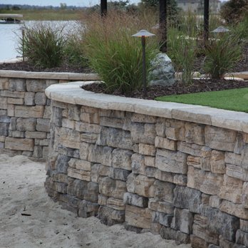 Clear Creek Landscapes - a stone retaining wall - Landscaping Near Me - Omaha, Nebraska