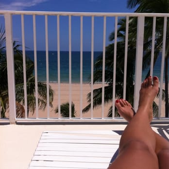 Pompano Beach Club - Lying by the pool - Apartments Near Me - Pompano Beach, Florida Pompano Beach Club - Lying by the pool - Apartments Near Me - Pompano Beach, Florida