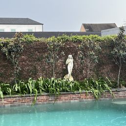 a statue of jesus in a pool a statue of jesus in a pool