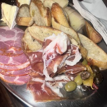 Lagniappe - Our charcuterie board - I believe that all boards come with olives, little toasts or some sort of cracker/bread and fig spread - Music Venues Near Me - Miami, Florida Lagniappe - Our charcuterie board - I believe that all boards come with olives, little toasts or some sort of cracker/bread and fig spread - Music Venues Near Me - Miami, Florida