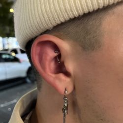 Freshly pierced Rook on right ear