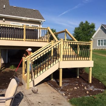 Adna's Landscape Design - Deck and stairs with decorative railing - Snow Removal Near Me - Grand Rapids, Michigan Adna's Landscape Design - Deck and stairs with decorative railing - Snow Removal Near Me - Grand Rapids, Michigan