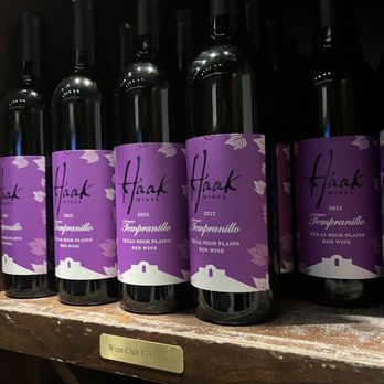 Haak Vineyards & Winery - a row of wine bottles - Wineries Near Me - Santa Fe, Texas Haak Vineyards & Winery - a row of wine bottles - Wineries Near Me - Santa Fe, Texas