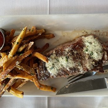 Theo's Steaks, Sides & Spirits - Rehoboth Beach - New York Strip steak with truffle fries. - Steakhouses Near Me - Rehoboth Beach, Delaware Theo's Steaks, Sides & Spirits - Rehoboth Beach - New York Strip steak with truffle fries. - Steakhouses Near Me - Rehoboth Beach, Delaware