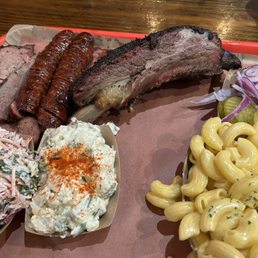 brisket, jalapeño cheese sausage, beef rib, complimentary onion pickle side, Cole slaw, potato salad, Mac n cheese brisket, jalapeño cheese sausage, beef rib, complimentary onion pickle side, Cole slaw, potato salad, Mac n cheese