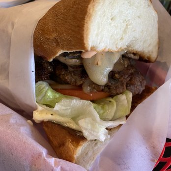 Cool Cat Cafe - The size of this burger just isn't given justice to it's actual in life size. It's massive. - Burgers Near Me - Kihei, Hawaii Cool Cat Cafe - The size of this burger just isn't given justice to it's actual in life size. It's massive. - Burgers Near Me - Kihei, Hawaii
