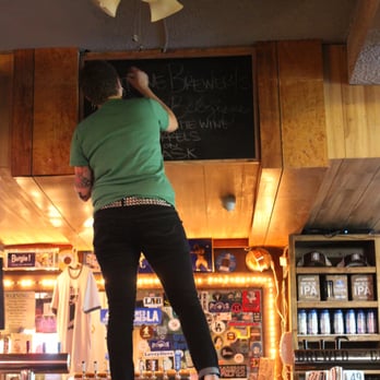 Tonys Darts Away - Bartender changing the "keg of the day" label. - Gastropubs Near Me - Burbank, California Tonys Darts Away - Bartender changing the "keg of the day" label. - Gastropubs Near Me - Burbank, California