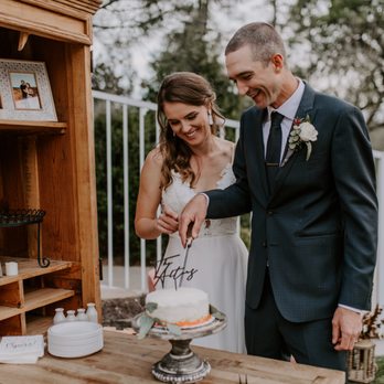 Trailer Full - a bride and groom cutting their wedding cake - Coffee & Tea Near Me Trailer Full - a bride and groom cutting their wedding cake - Coffee & Tea Near Me