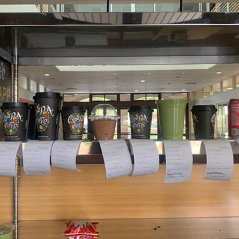 Coupa Cafe - Y2E2 - a row of coffee cups on display - Coffee & Tea Near Me - Stanford, California