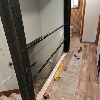 Lovell Home Services - This was a wall blocking off the stair well. The wall was knocked out and replaced by these two industrial rails! - Handyman Near Me Lovell Home Services - This was a wall blocking off the stair well. The wall was knocked out and replaced by these two industrial rails! - Handyman Near Me