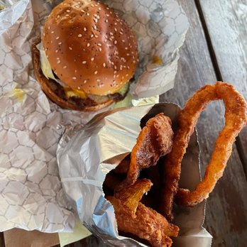Goldie's Burgers - Cheeseburger and the thick cut onion rings that were greasy, over-salted, and burnt. - Salad Near Me - Gainesville, Florida