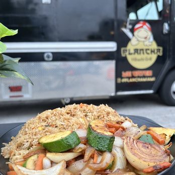 Plancha - a plate of vegetables and rice with a truck in the background - Teppanyaki Near Me - Miami, Florida Plancha - a plate of vegetables and rice with a truck in the background - Teppanyaki Near Me - Miami, Florida