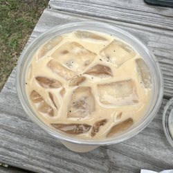 Underground Bakery - Iced latte with coffee grounds floating