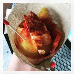 Fruit cup with chile, lime, and salt.