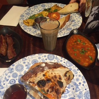 Dishoom - Best bottomless chai, Bombay omelette and sausage egg naan roll. - Indian Near Me - London, XGL Dishoom - Best bottomless chai, Bombay omelette and sausage egg naan roll. - Indian Near Me - London, XGL