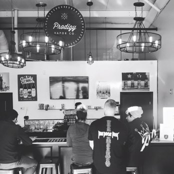 Prodigy Vapor Company - Justin and Chris helping out a customer with their first purchase. - Vape Shops Near Me - Moore, Oklahoma Prodigy Vapor Company - Justin and Chris helping out a customer with their first purchase. - Vape Shops Near Me - Moore, Oklahoma