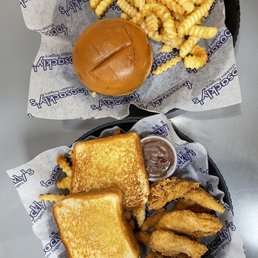 two baskets of fries and a sandwich