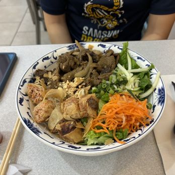 Bep Co Tham - KN Kitchen - Stir-fried beef vermicelli w/ fried egg roll - Vietnamese Near Me - Austin, Texas Bep Co Tham - KN Kitchen - Stir-fried beef vermicelli w/ fried egg roll - Vietnamese Near Me - Austin, Texas